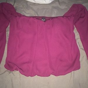 A maroon blouse off the shoulder.